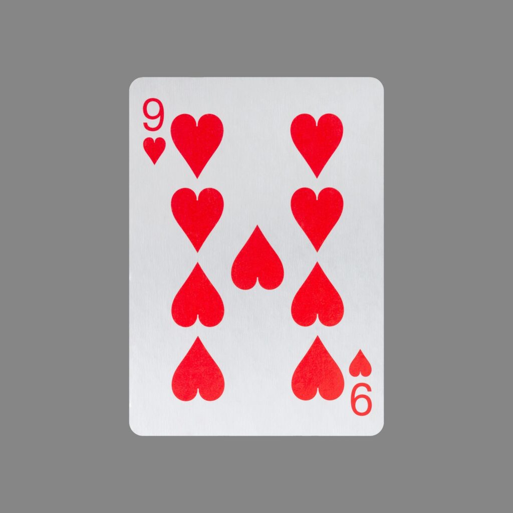Nine of Hearts. Isolated on a gray background. Gamble. Playing cards.